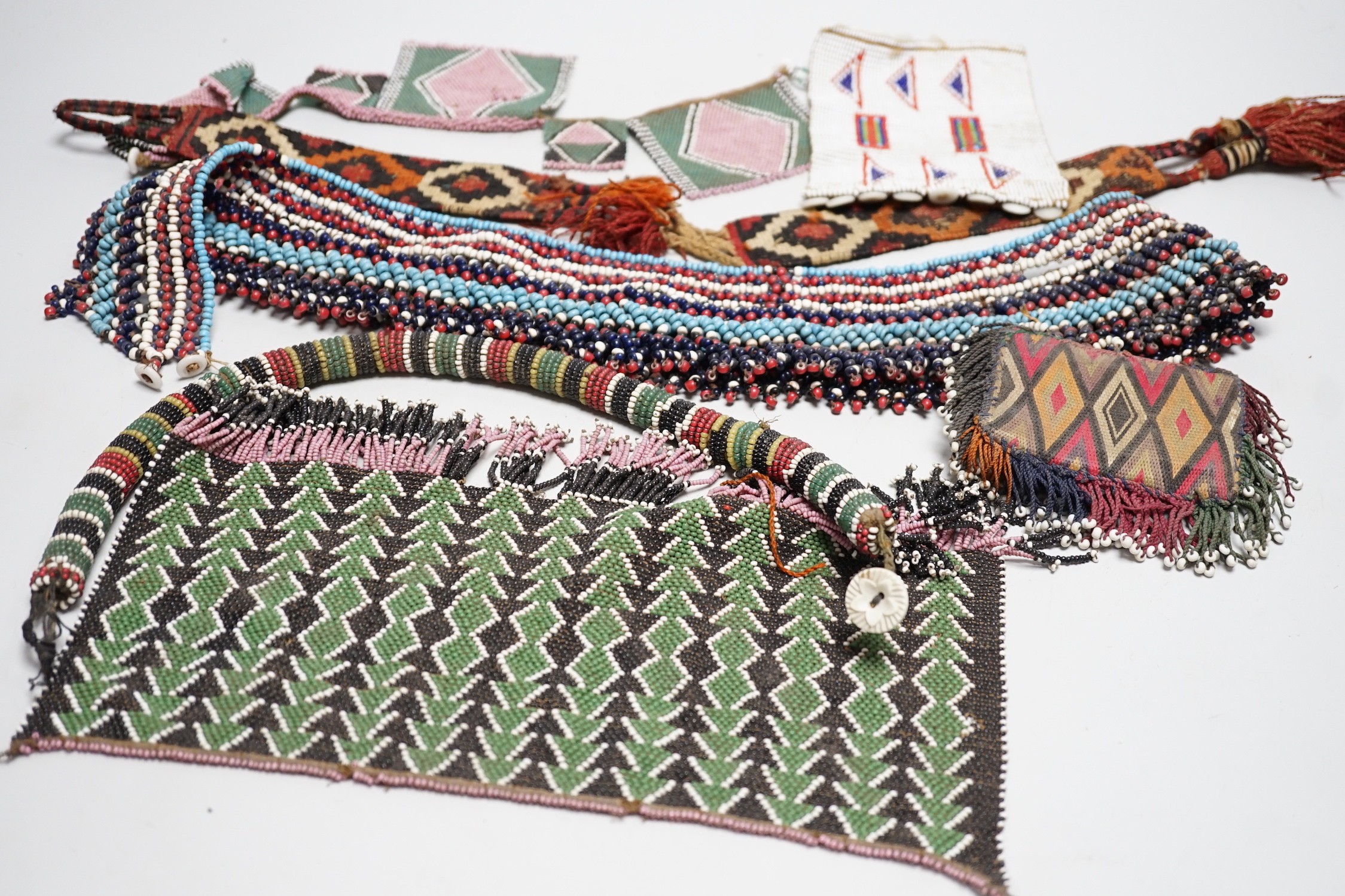 A selection of tribal geometric beadwork, to include a waistband believed to be Zulu